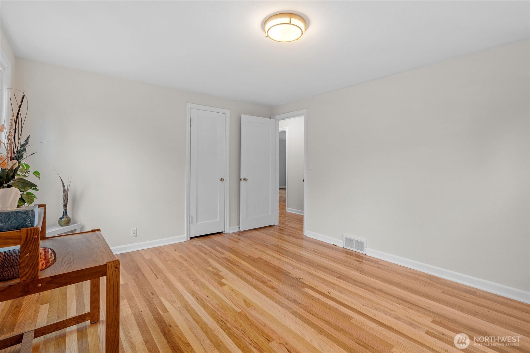 9748 Dayton Avenue North Seattle, WA 98103 - Photo 14 of 39 a view of a room with wooden floor and bathroom