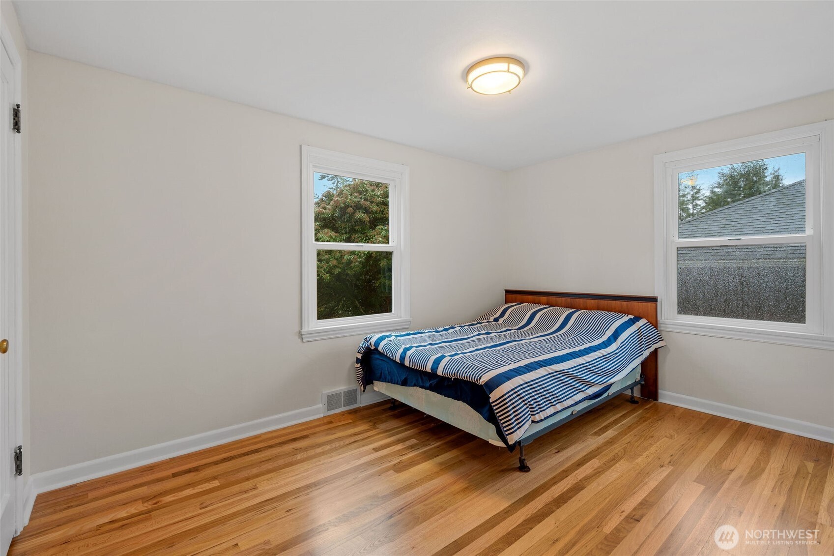 9748 Dayton Avenue North Seattle, WA 98103 - Photo 15 of 39 a living room with a bed furniture and a window