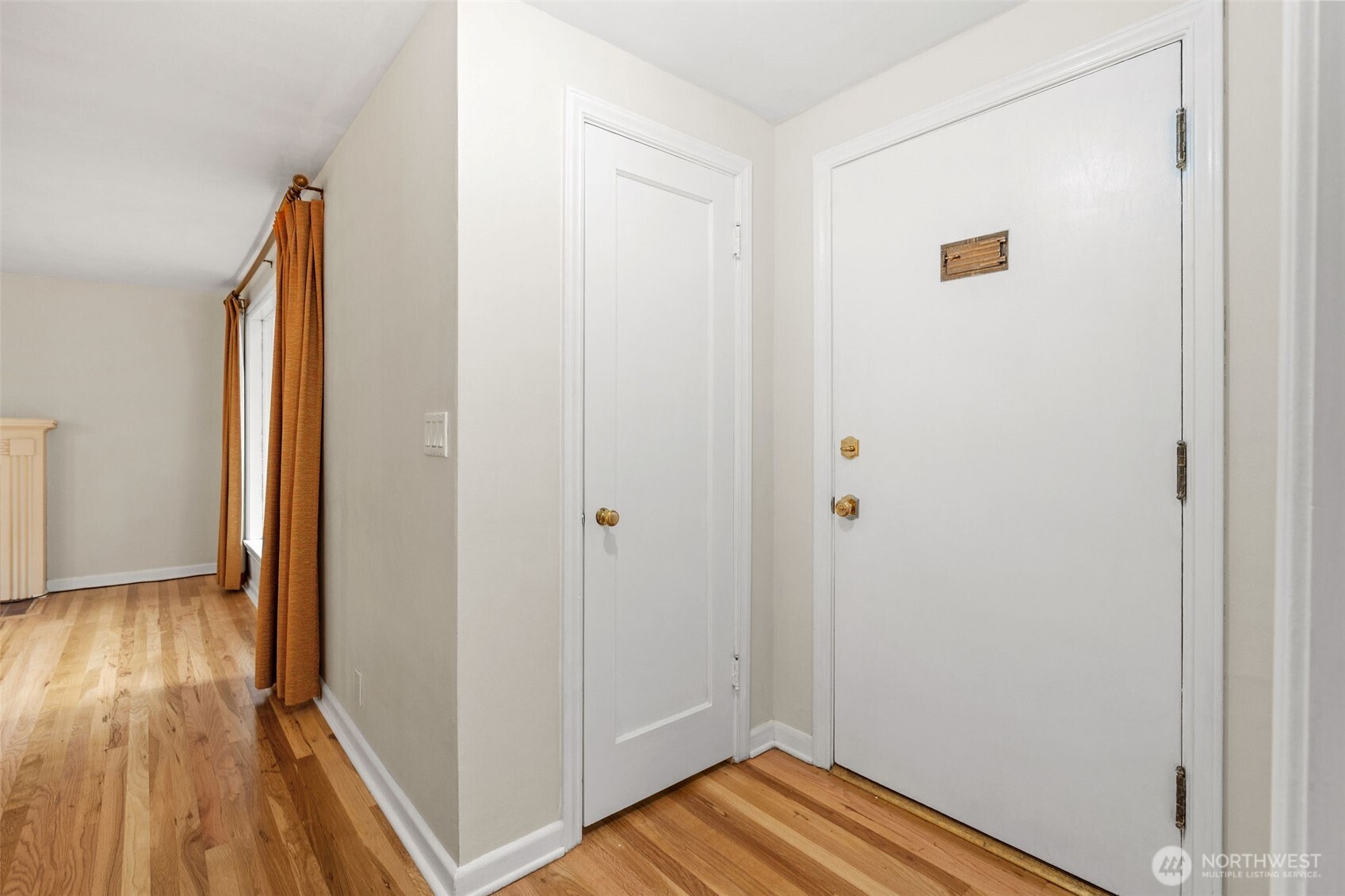 9748 Dayton Avenue North Seattle, WA 98103 - Photo 18 of 39 a view of a hallway with wooden floor