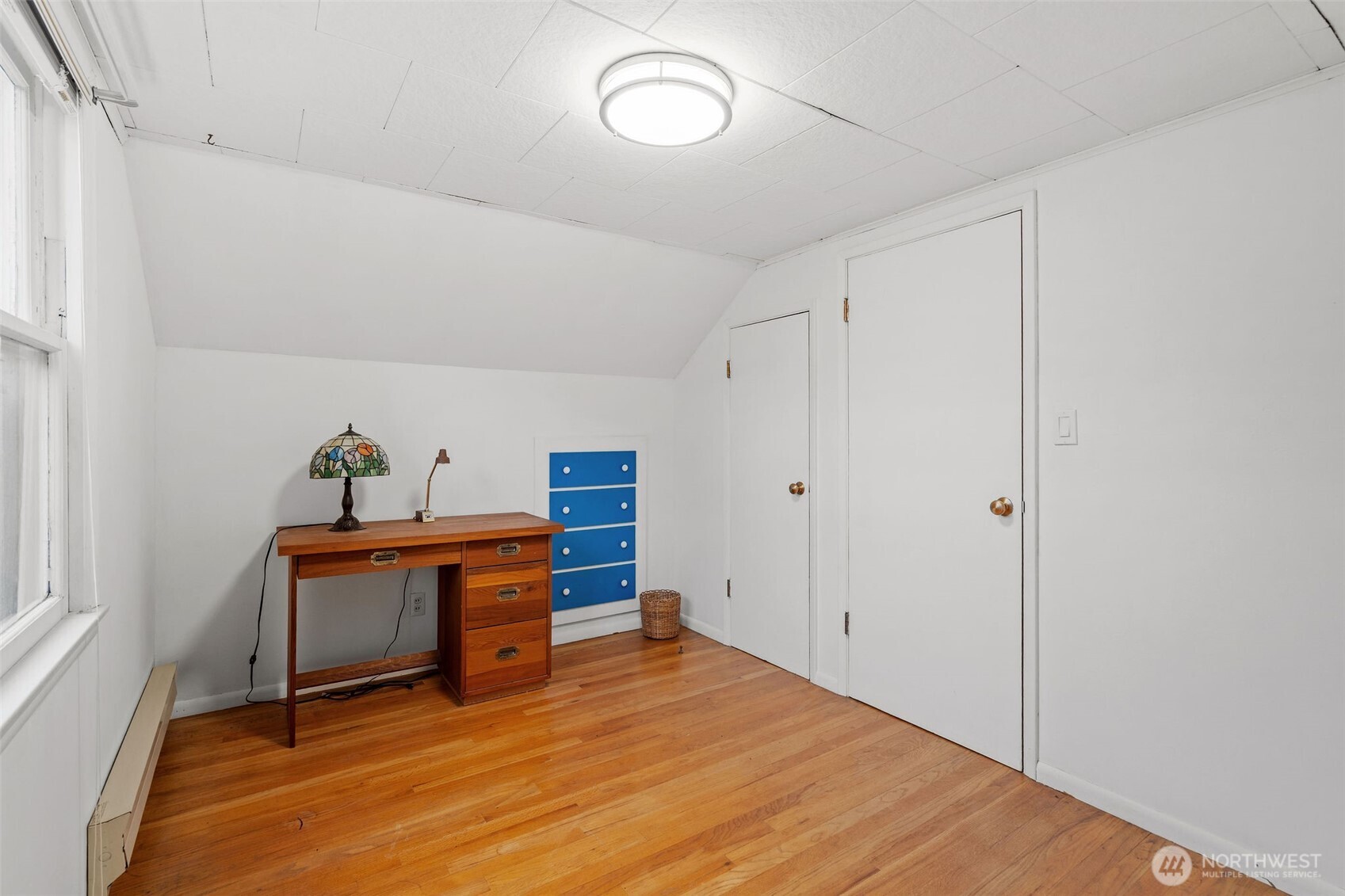 9748 Dayton Avenue North Seattle, WA 98103 - Photo 24 of 39 a view of room with furniture and wooden floor