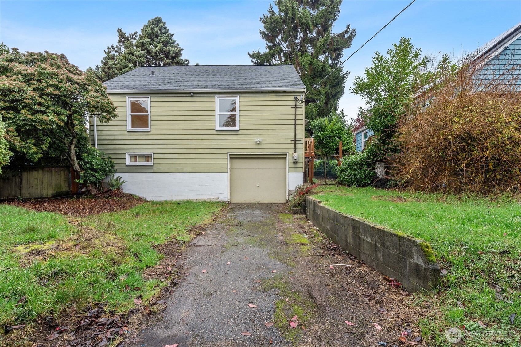 9748 Dayton Avenue North Seattle, WA 98103 - Photo 35 of 39 a view of a house with yard and a garage