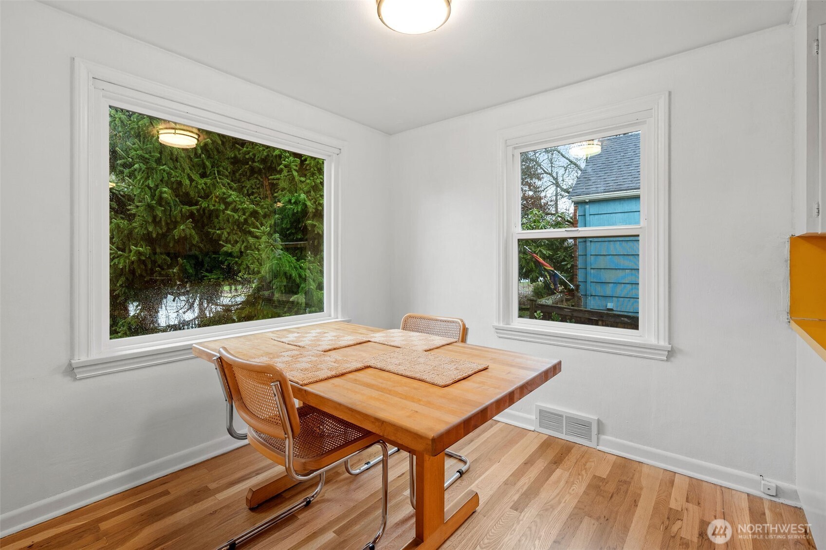 9748 Dayton Avenue North Seattle, WA 98103 - Photo 7 of 39 a view of a dining room with furniture window and outside view