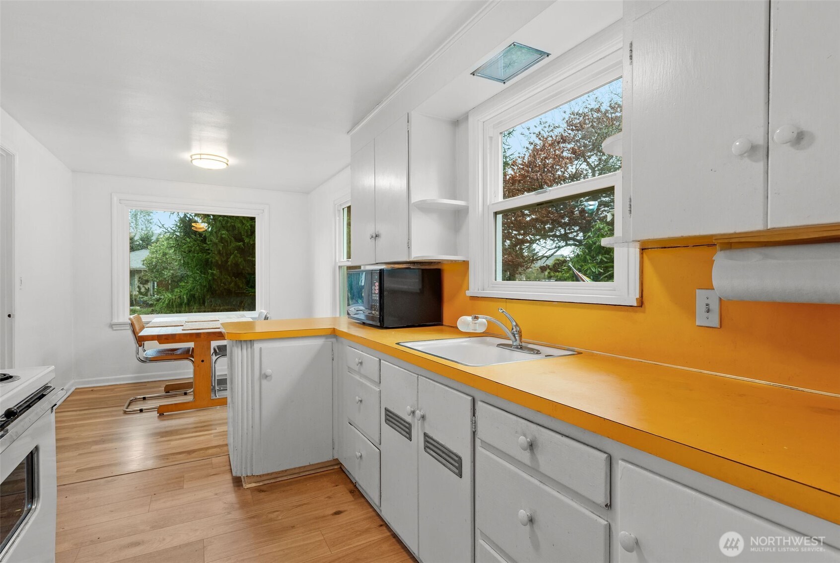 9748 Dayton Avenue North Seattle, WA 98103 - Photo 10 of 39 a view of a kitchen with a large window