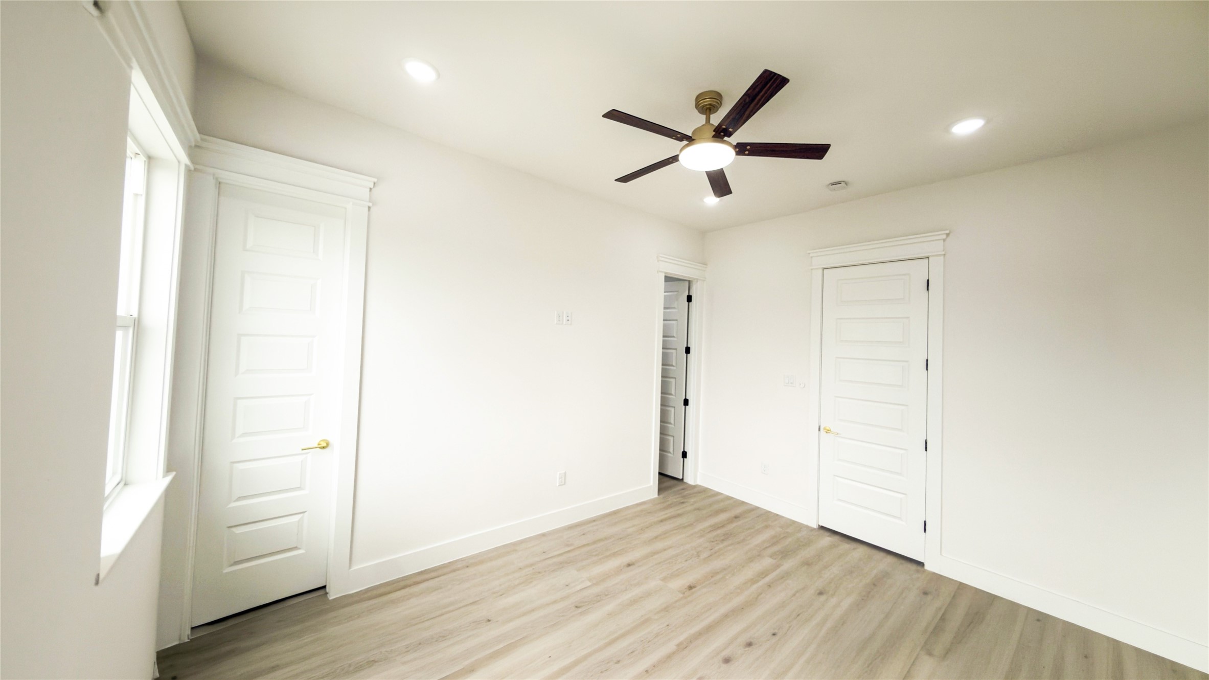 823 North Loop Houston, TX 77022 - Photo 11 of 23 a view of empty room with wooden floor