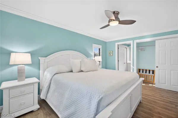 a bedroom with a bed and a night stand