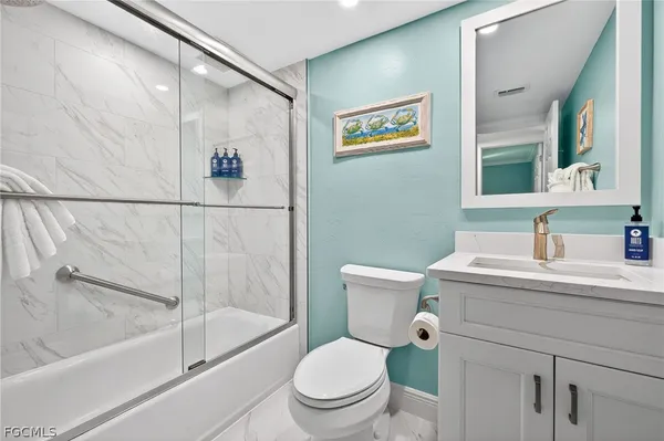 a bathroom with a sink a toilet and a bathtub