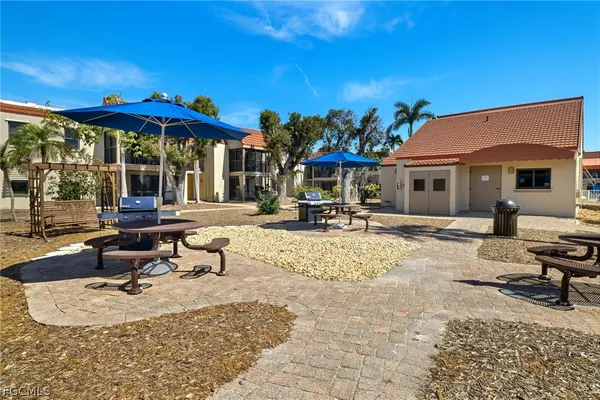 a view of a patio with swimming pool