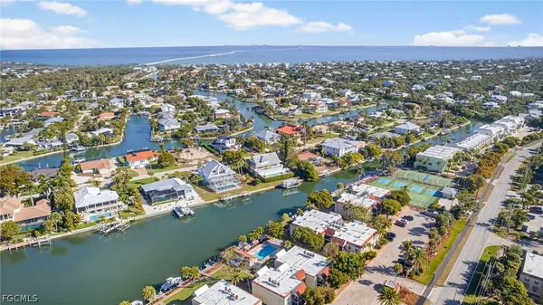 an aerial view of residential building and ocean view