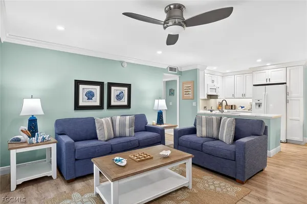 a living room with furniture and a lamp