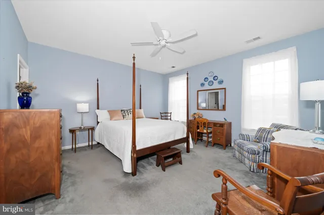 a bedroom with furniture and a bed