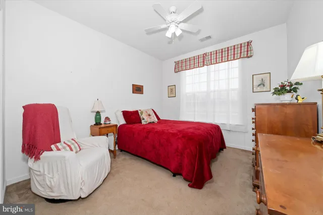 a bed room with a bed and a couch