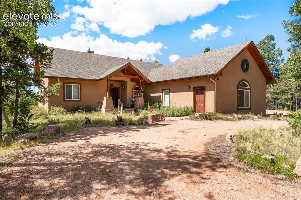 131 Paradiso Road Divide, CO 80814 - Photo 9 of 50 a view of a house with a yard