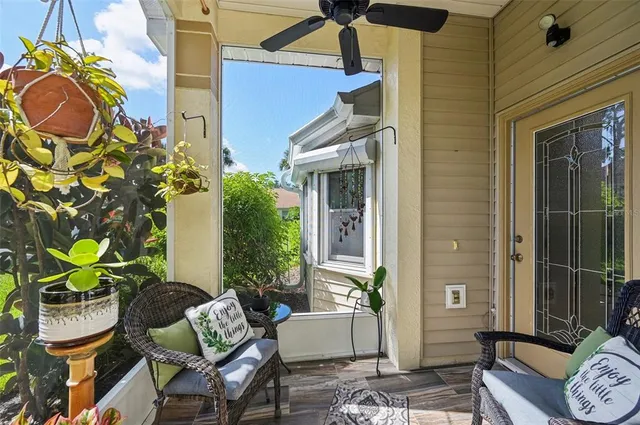a view of a house with backyard and sitting area