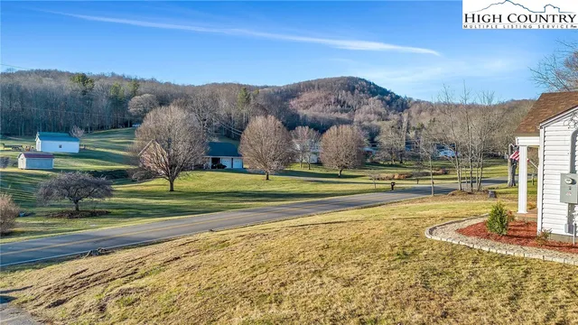 a view of a town with mountains in the background