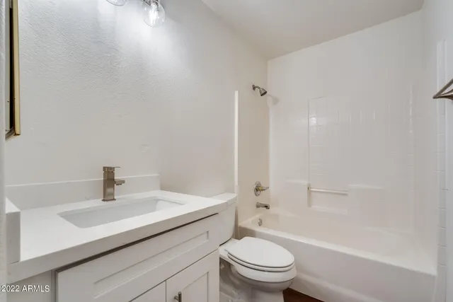 a bathroom with a sink toilet and a bathtub
