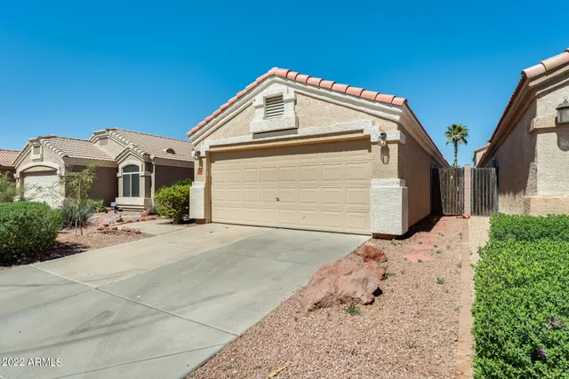 a front view of a house with a garage