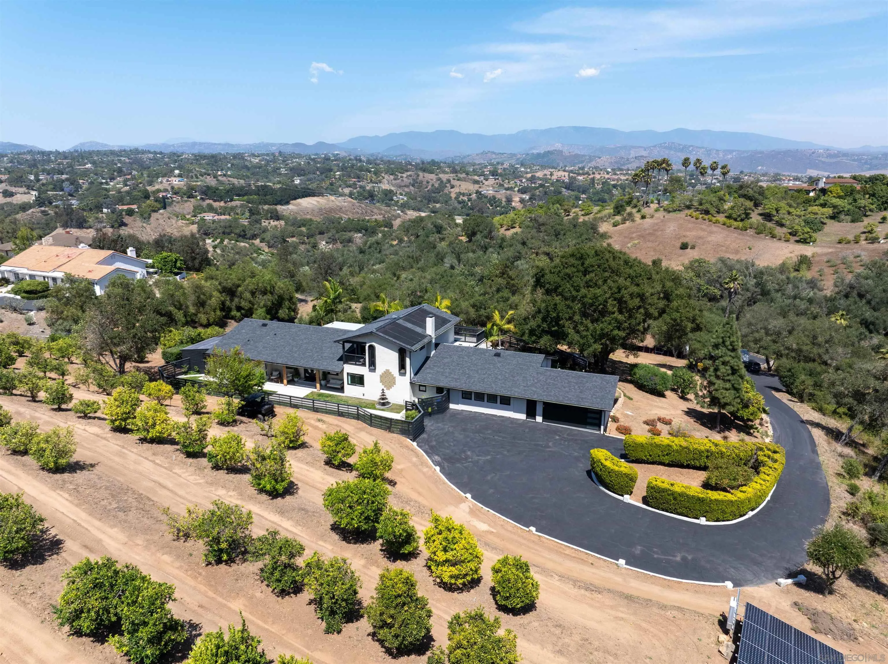 521 Rancho Camino Fallbrook, CA 92028 - Photo 59 of 72 an aerial view of a house with yard swimming pool and mountain view