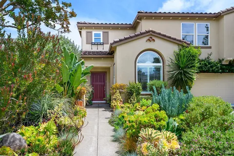 front view of a house with a garden