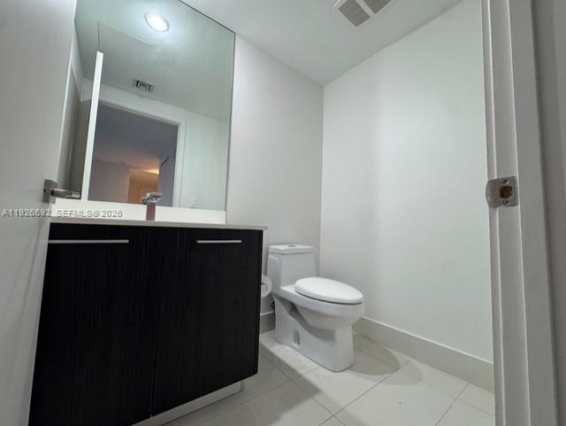 45 Southwest 9th Street, Unit 2209 Miami, FL 33130 - Photo 17 of 31 a bathroom with a sink and a toilet