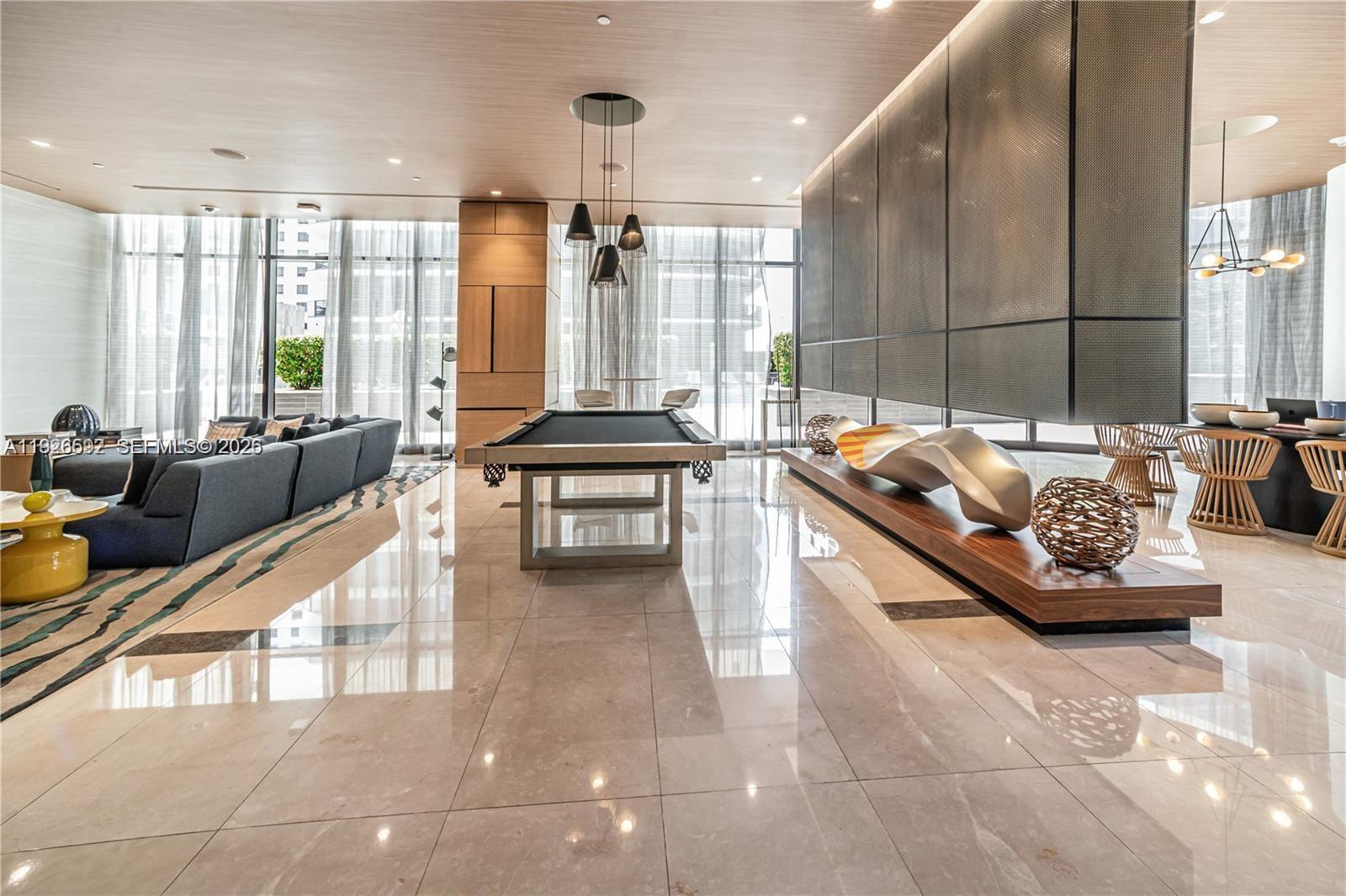 45 Southwest 9th Street, Unit 2209 Miami, FL 33130 - Photo 22 of 31 a living room with furniture and large windows