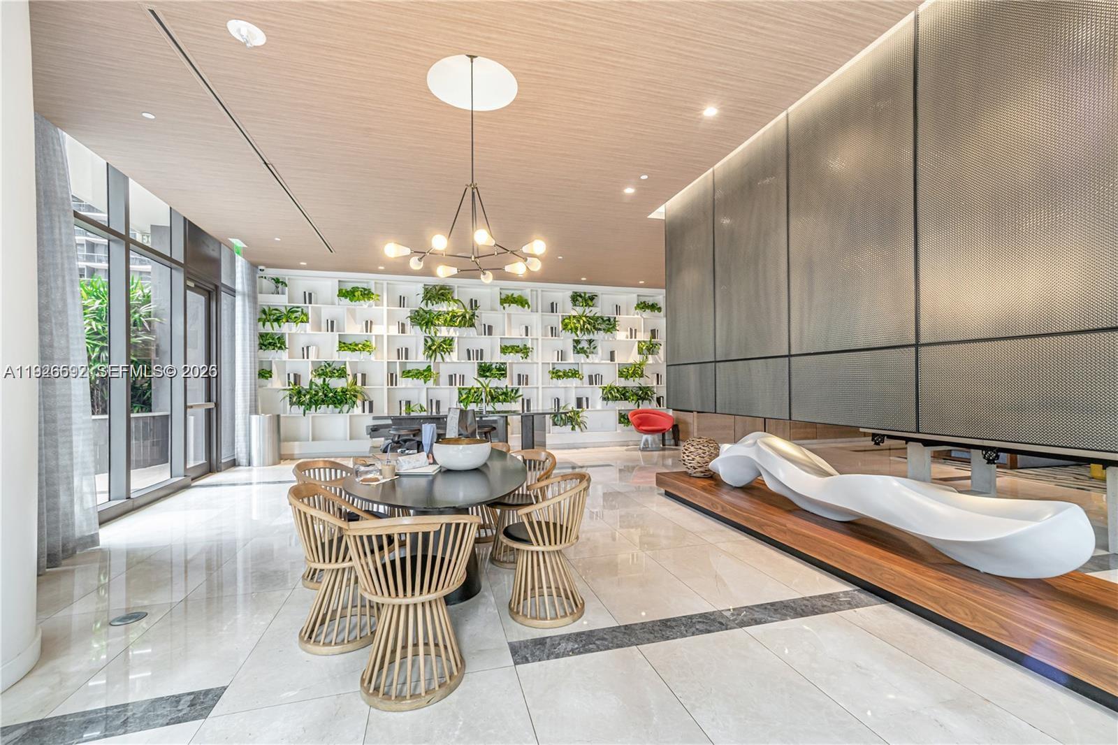 45 Southwest 9th Street, Unit 2209 Miami, FL 33130 - Photo 25 of 31 a dining room with furniture a chandelier and window