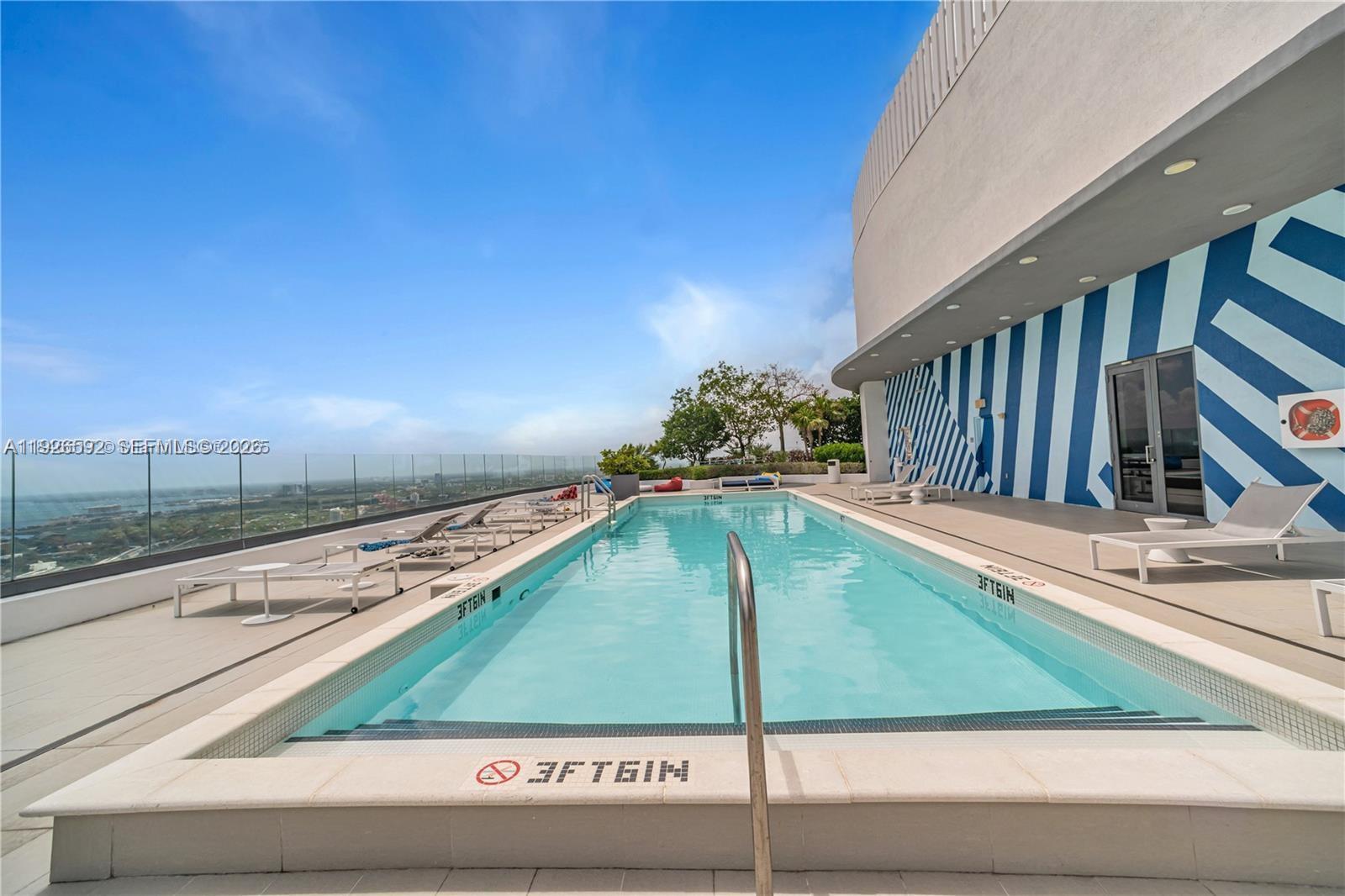 45 Southwest 9th Street, Unit 2209 Miami, FL 33130 - Photo 27 of 31 a view of a balcony with floor to ceiling windows