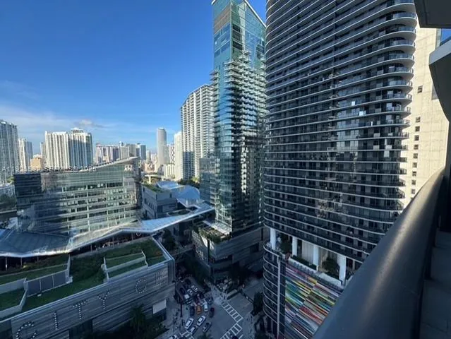 a view of a balcony with two chairs and a table