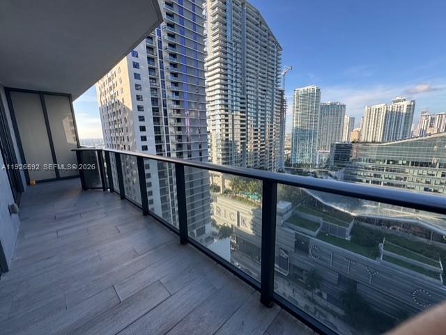 45 Southwest 9th Street, Unit 2209 Miami, FL 33130 - Photo 9 of 31 a view of a balcony with furniture