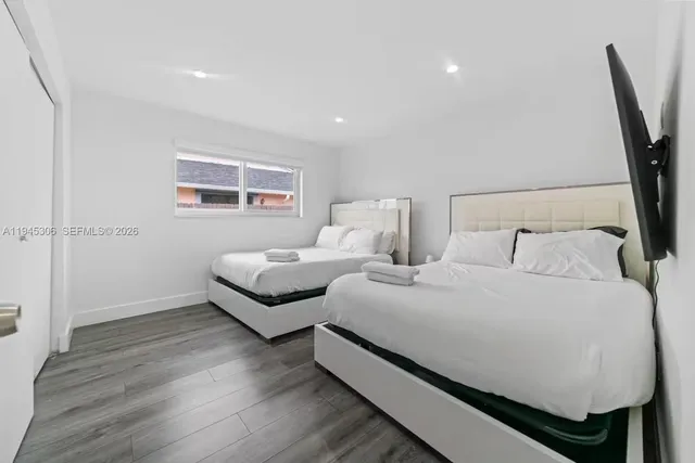 a bed room with bed and a window