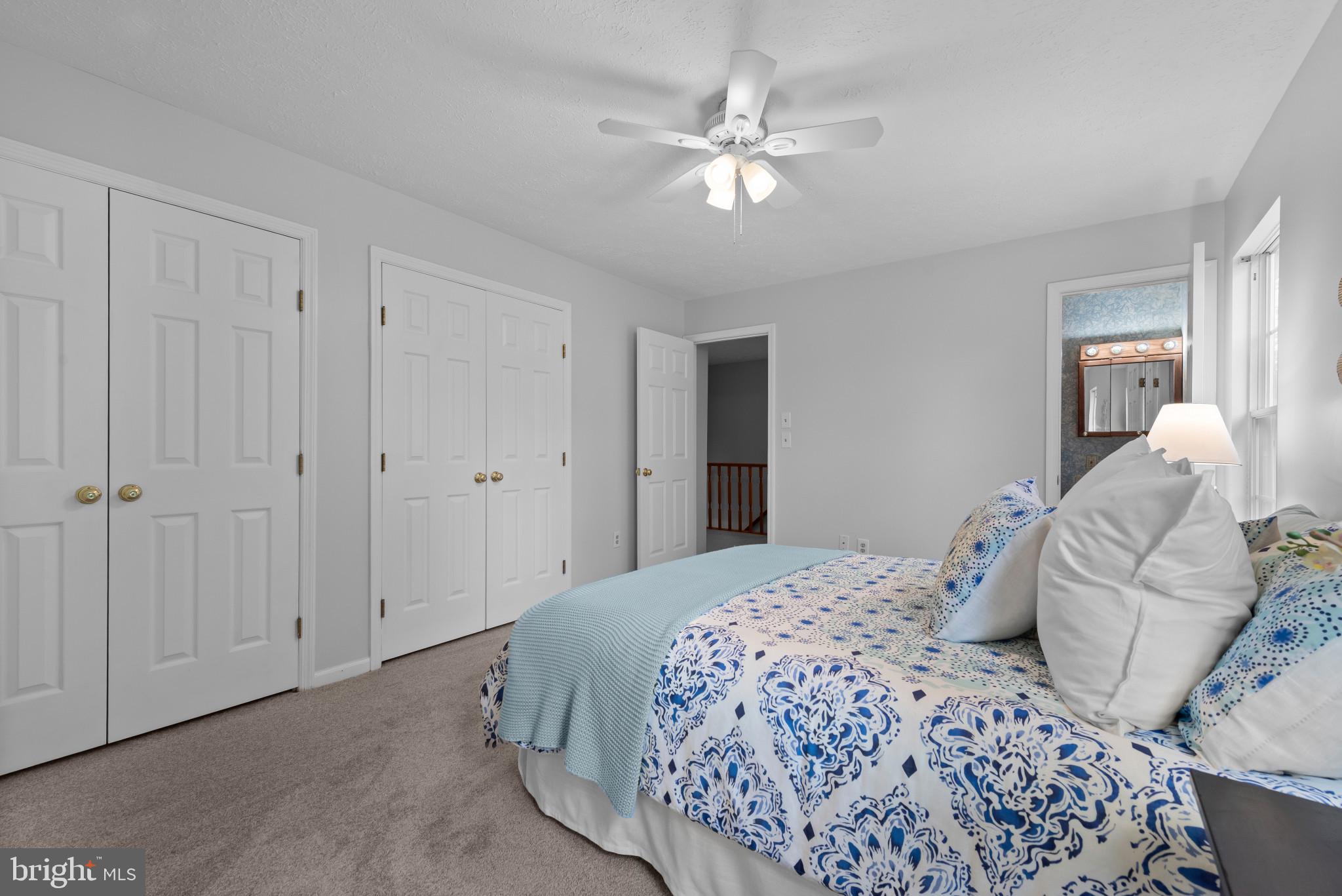 3107 Pouska Road Abingdon, MD 21009 - Photo 24 of 38 a bedroom with a bed and a chandelier