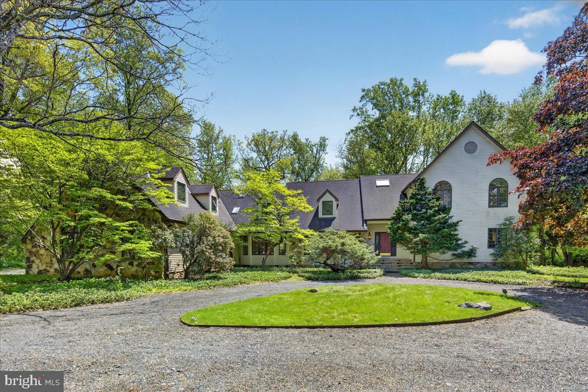 255 Arreton Road Princeton, NJ 08540 - Photo 1 of 65 a view of a white house with a yard and large tree