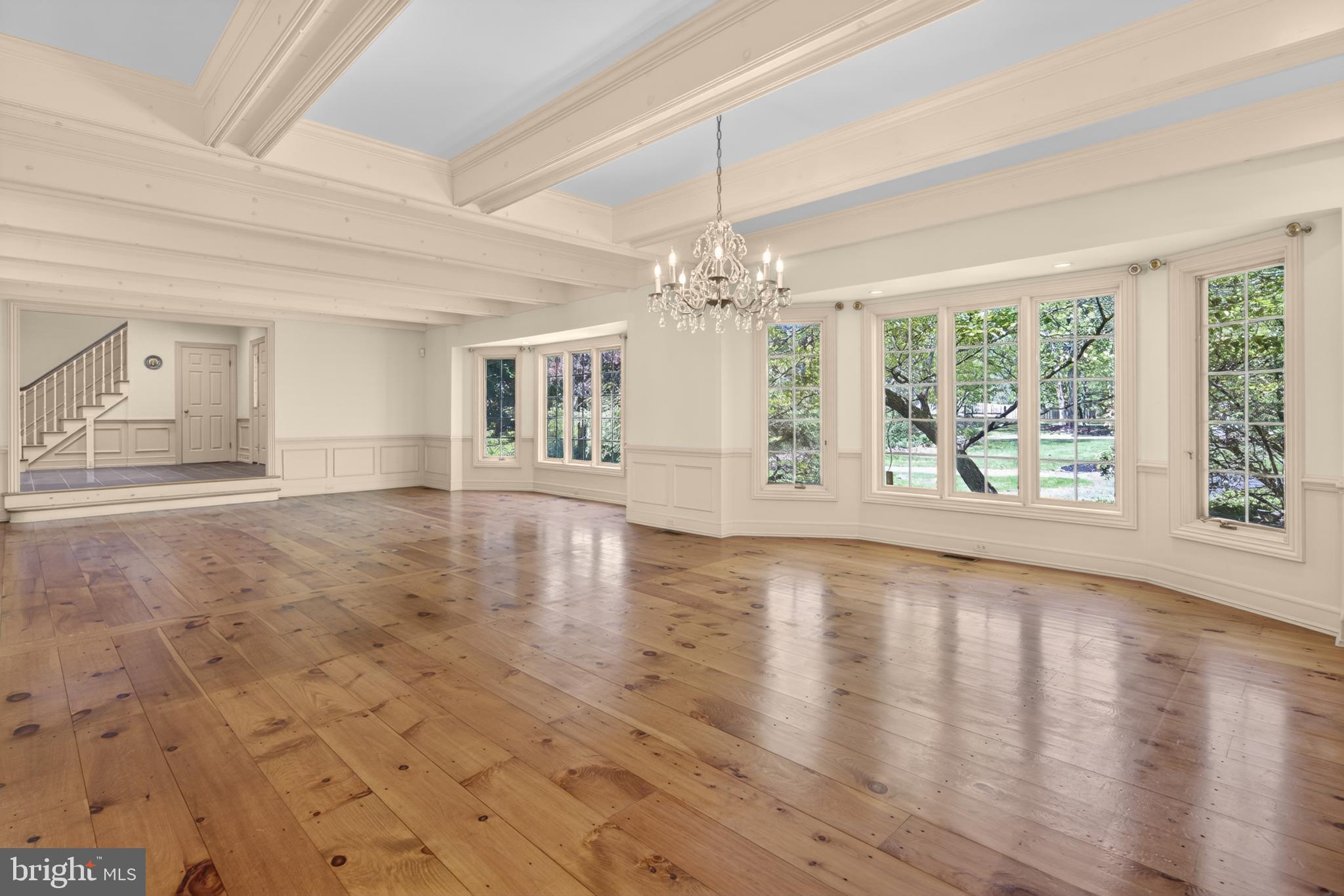 255 Arreton Road Princeton, NJ 08540 - Photo 13 of 65 a view of an empty room with wooden floor and a window