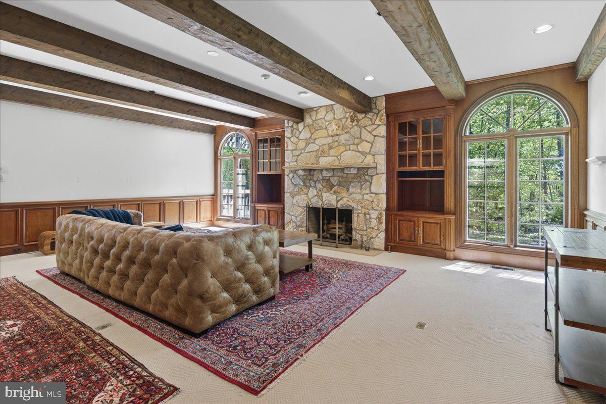 255 Arreton Road Princeton, NJ 08540 - Photo 19 of 65 a living room with a couch and a fireplace