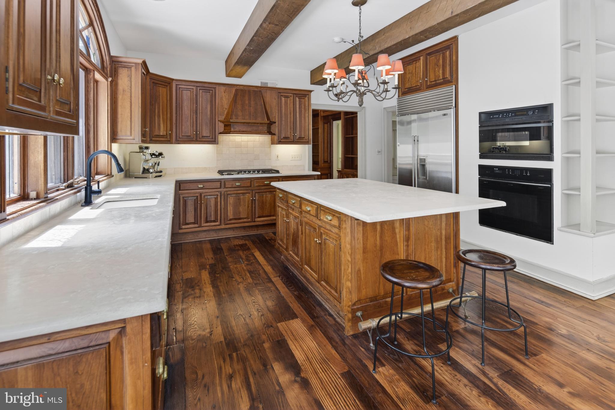 255 Arreton Road Princeton, NJ 08540 - Photo 26 of 65 a kitchen with a stove a refrigerator and wooden floor