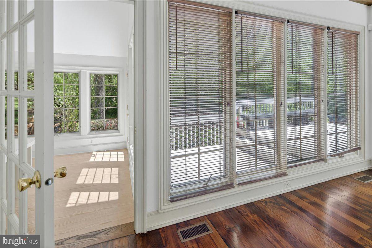 255 Arreton Road Princeton, NJ 08540 - Photo 30 of 65 a view of an empty room with wooden floor and a window
