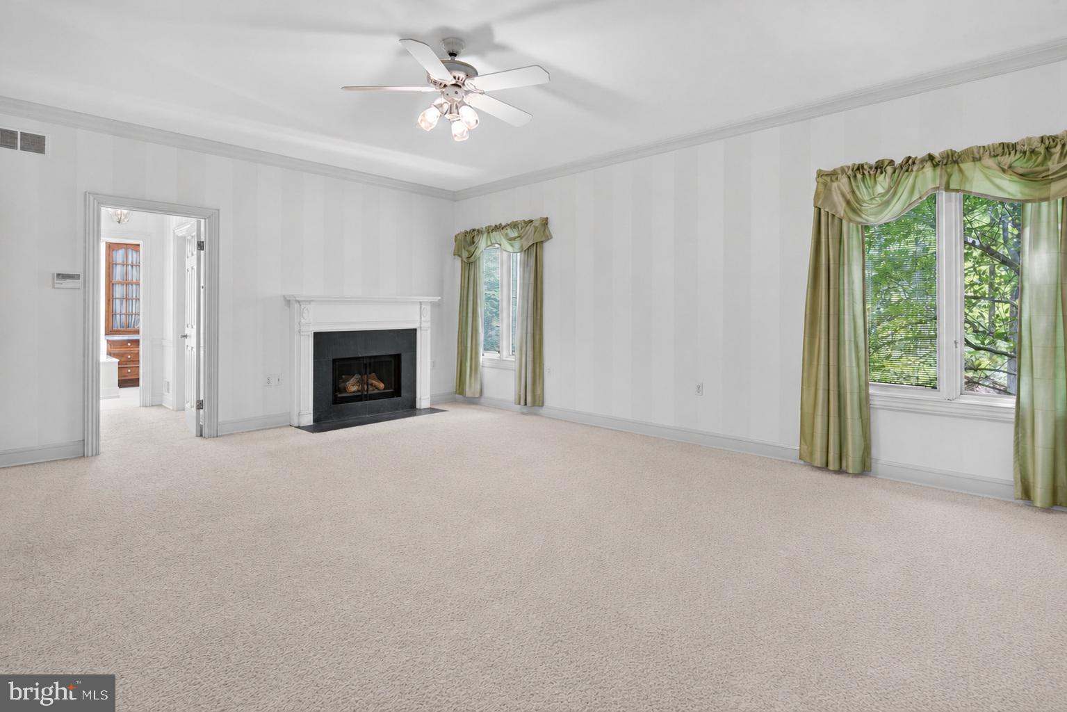 255 Arreton Road Princeton, NJ 08540 - Photo 31 of 65 a view of empty room with fireplace and fan