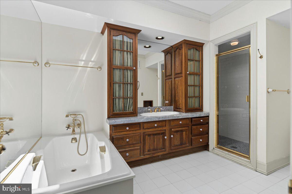 255 Arreton Road Princeton, NJ 08540 - Photo 36 of 65 a bathroom with a tub sink and mirror