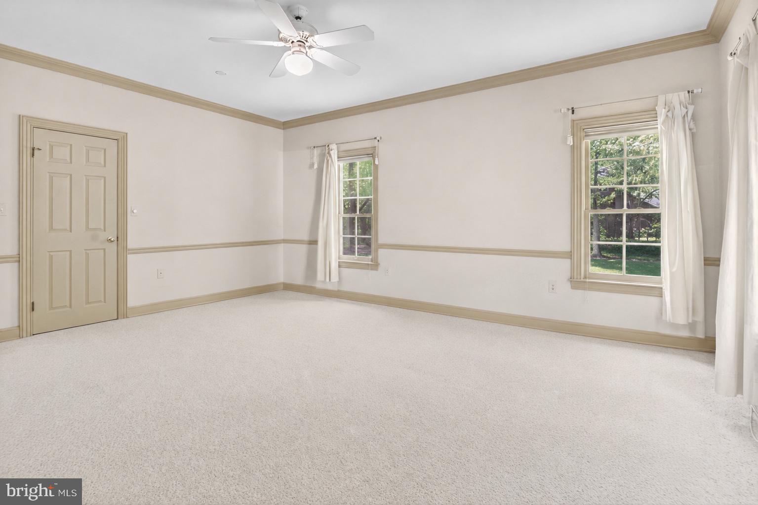 255 Arreton Road Princeton, NJ 08540 - Photo 37 of 65 an empty room with windows and fan