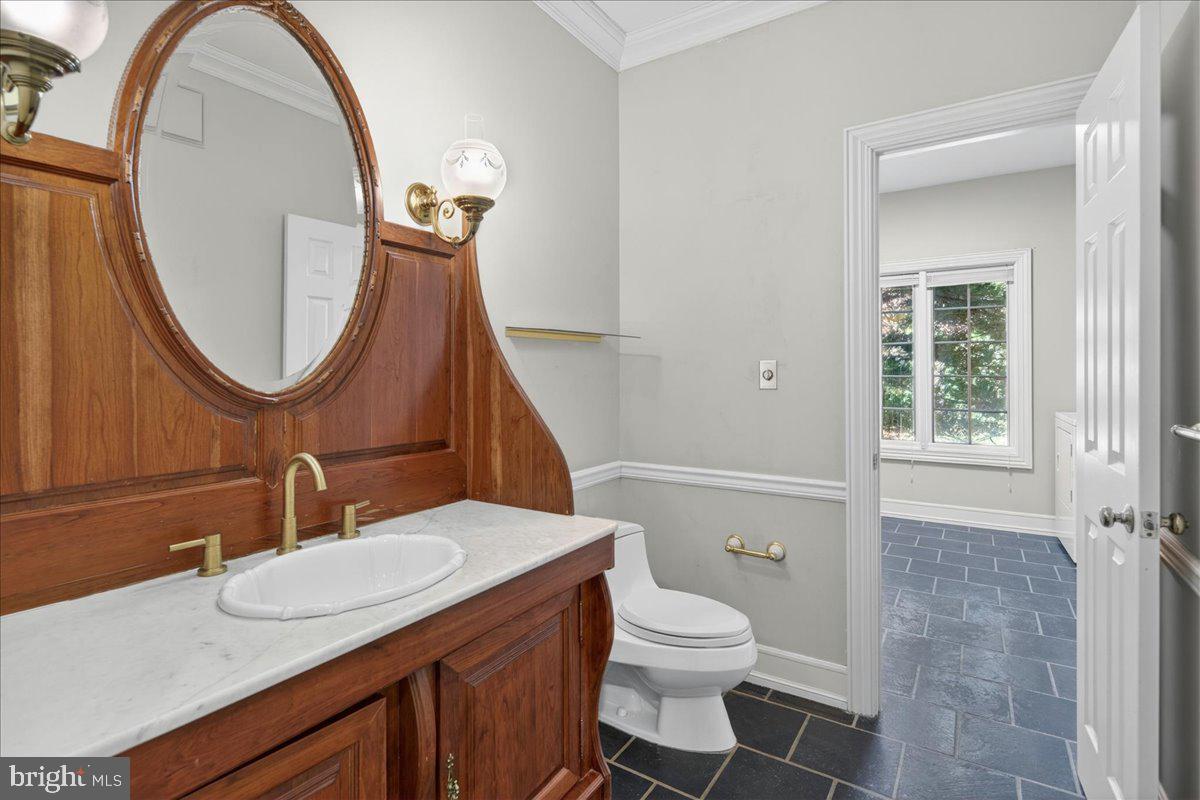 255 Arreton Road Princeton, NJ 08540 - Photo 39 of 65 a bathroom with a sink a toilet and a mirror