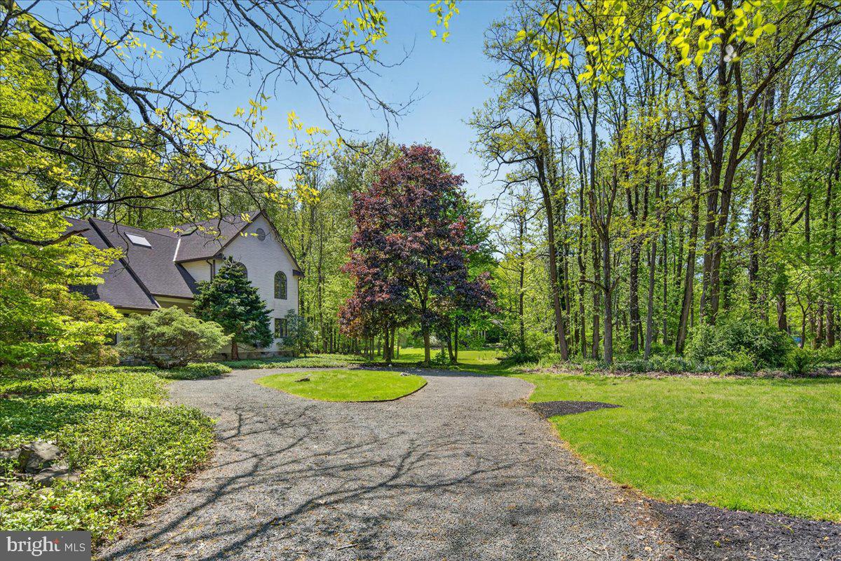 255 Arreton Road Princeton, NJ 08540 - Photo 4 of 65 a view of a swimming pool with a garden