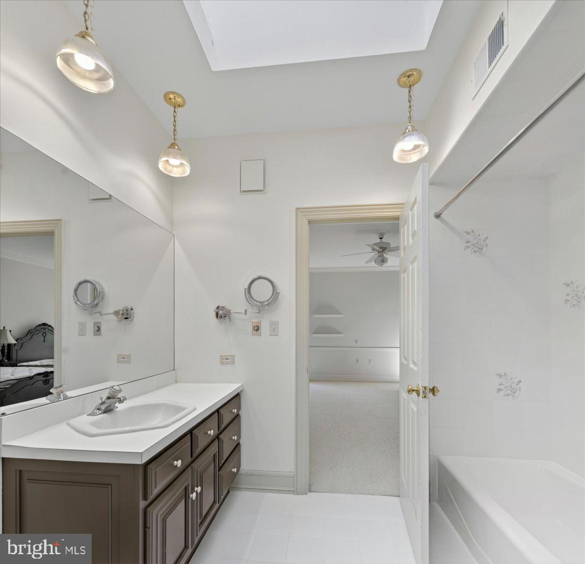 255 Arreton Road Princeton, NJ 08540 - Photo 45 of 65 a bathroom with a double vanity sink mirror and shower