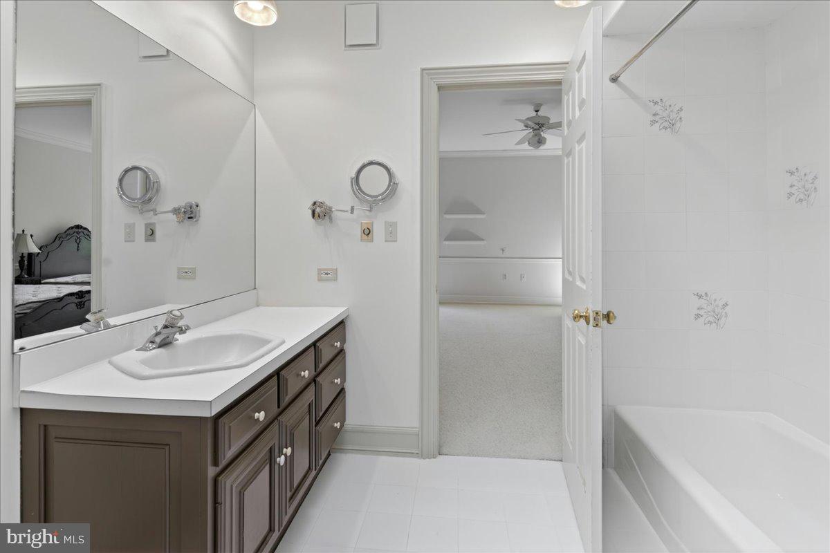 255 Arreton Road Princeton, NJ 08540 - Photo 46 of 65 a bathroom with a sink double vanity and tub