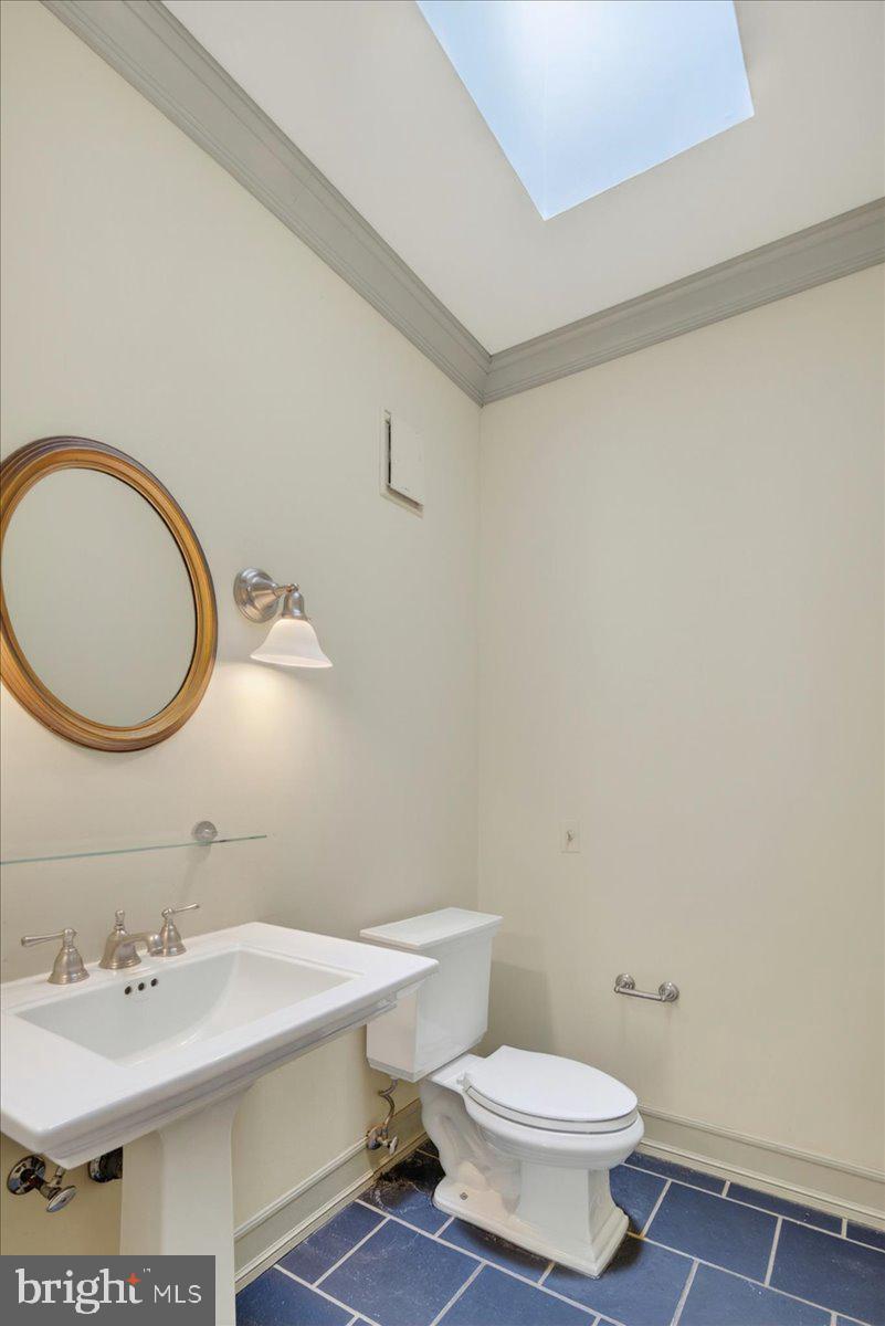 255 Arreton Road Princeton, NJ 08540 - Photo 47 of 65 a bathroom with a sink a mirror and a toilet