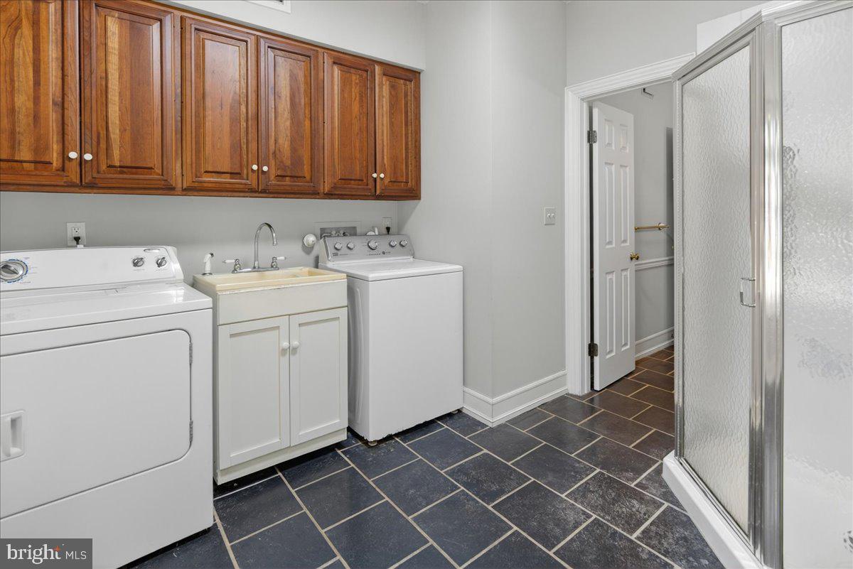 255 Arreton Road Princeton, NJ 08540 - Photo 48 of 65 a view of a storage and utility room with washer and dryer