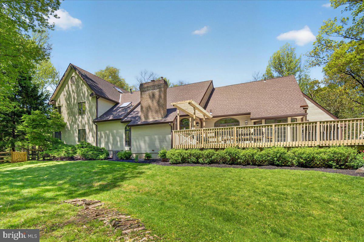 255 Arreton Road Princeton, NJ 08540 - Photo 61 of 65 a front view of a house with a yard and potted plants