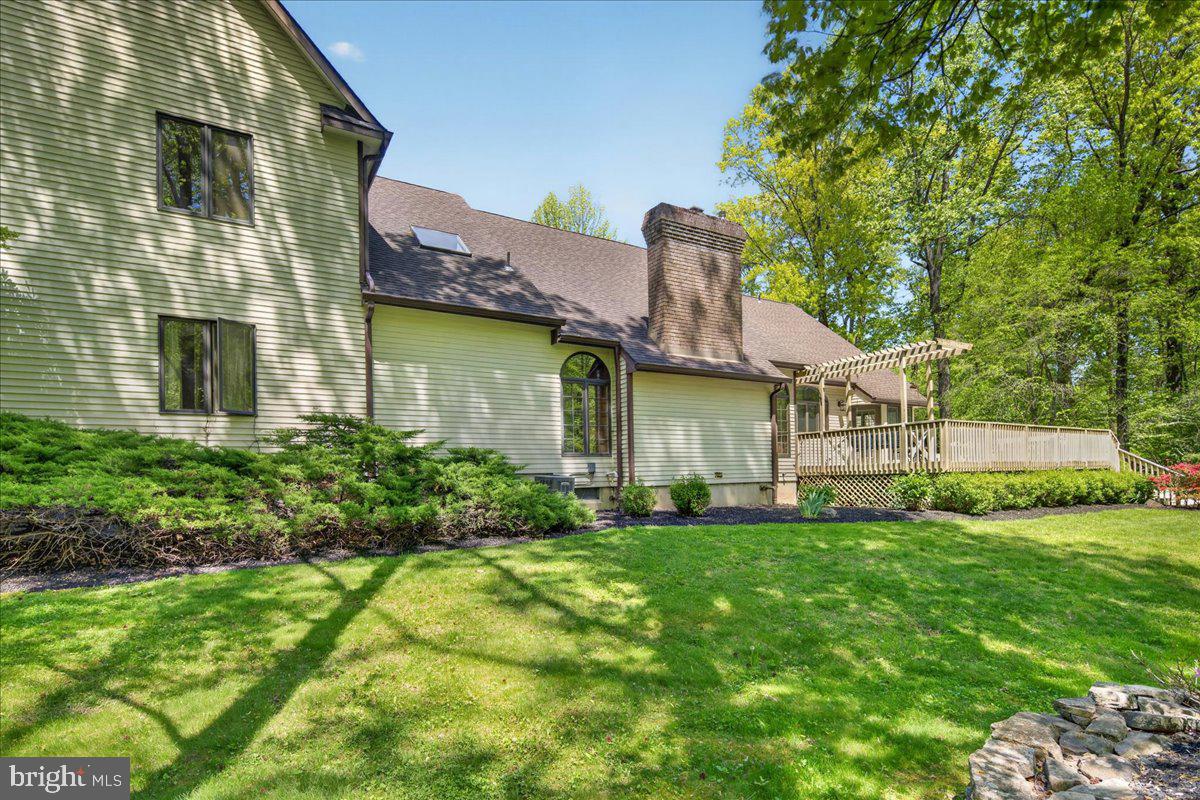 255 Arreton Road Princeton, NJ 08540 - Photo 62 of 65 a view of a house with a yard and sitting area