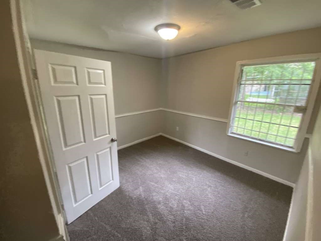 5322 Dewberry Street Houston, TX 77021 - Photo 5 of 12 an empty room with windows