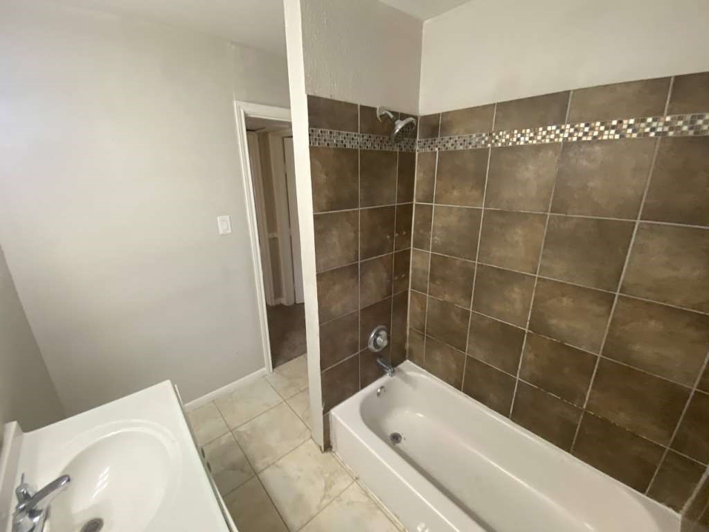 5322 Dewberry Street Houston, TX 77021 - Photo 8 of 12 a bathroom with a bathtub and shower