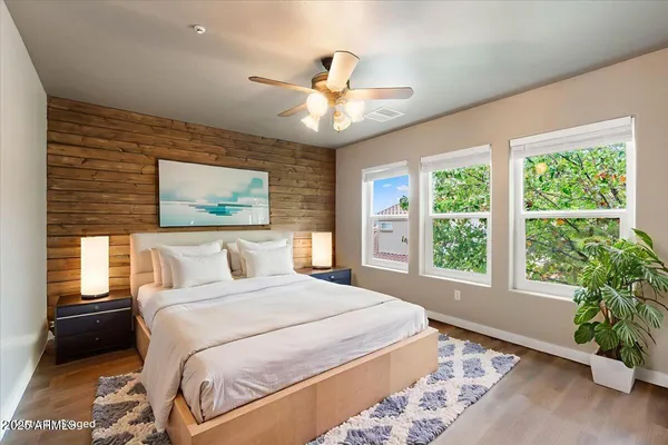 a bedroom with a large bed and a window