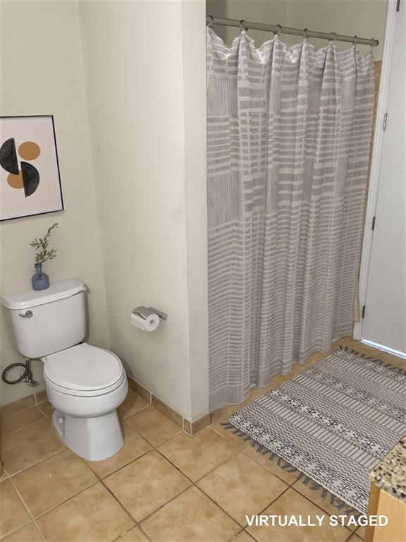 711 Cosmopolitan Drive Northeast, Unit 527 Atlanta, GA 30324 - Photo 9 of 9 a bathroom with a toilet and a shower